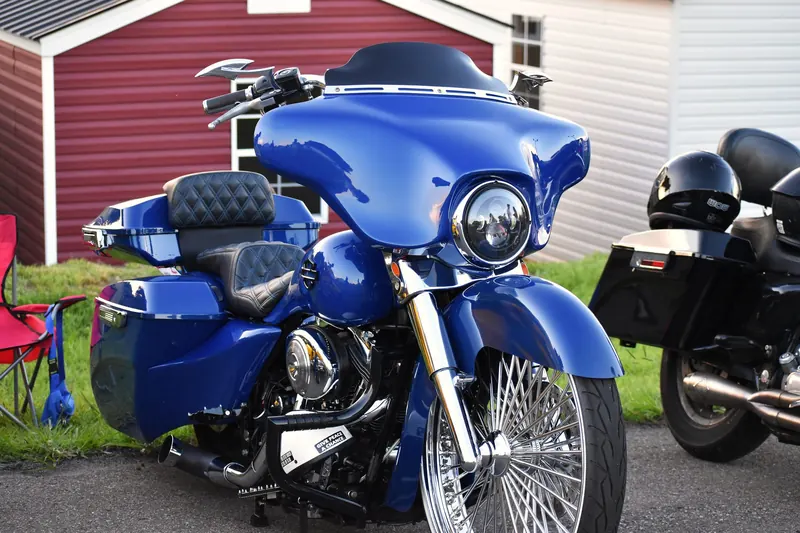 A blue custom bagger parked by the red barn at Eats on 601 in Mocksville